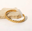 Twisted adjustable bangle
