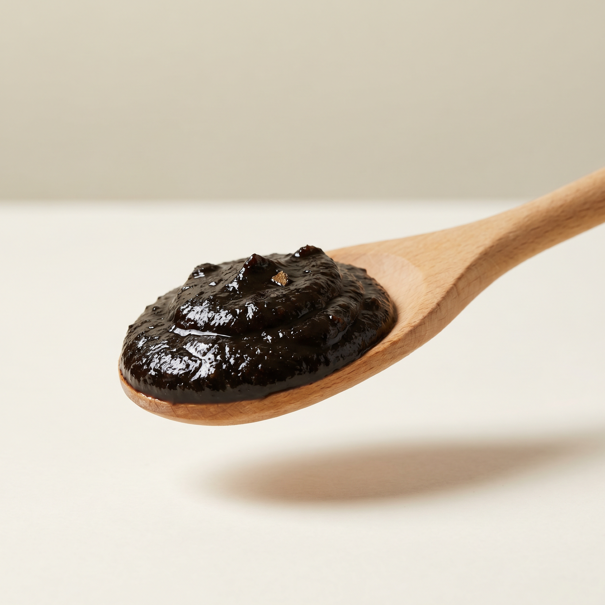 Black Garlic Puree — 7 oz — product texture close-up