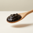 Black Garlic Puree — 7 oz — product texture close-up